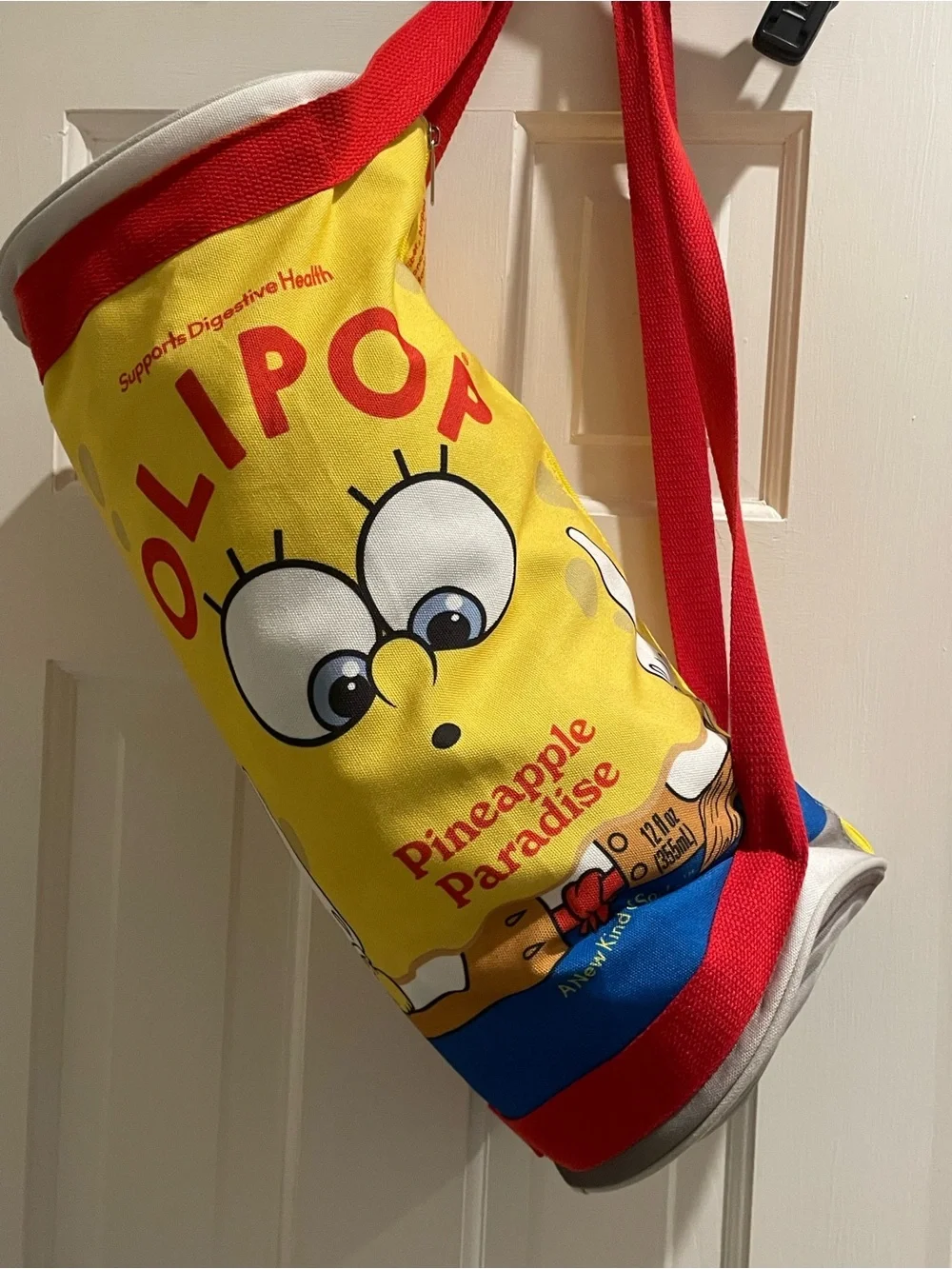Olipop X SpongeBob Squarepants pineapple paradise cylinder duffle bag. 18”